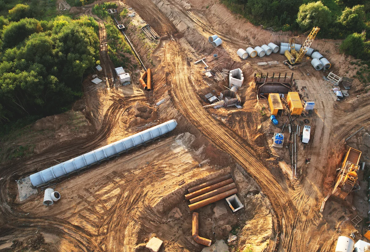 Concrete sewer pipes being laid. Image courtesy of Max Safaniuk at stock.adobe.com